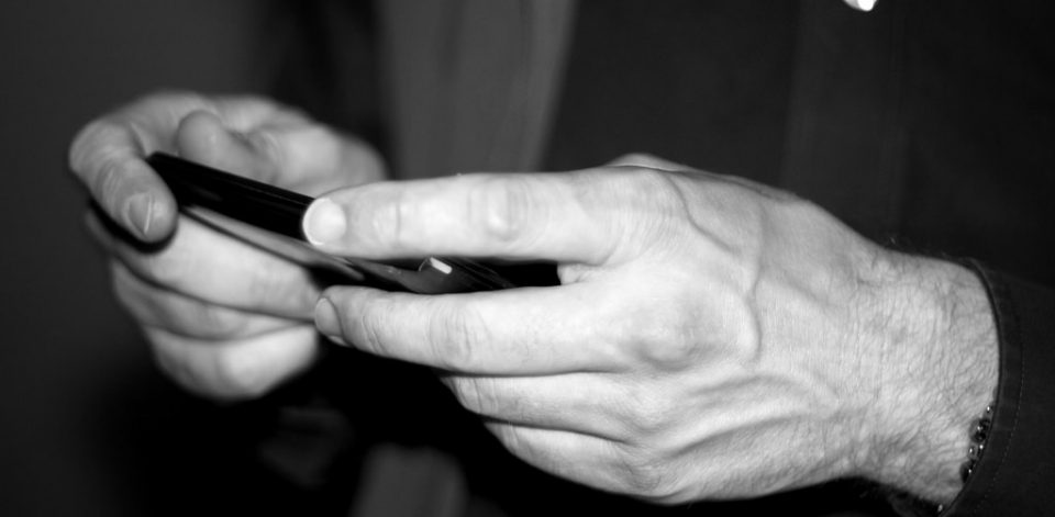 Hands using a smart phone